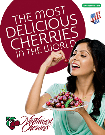 Woman holding cherries and about to bite one